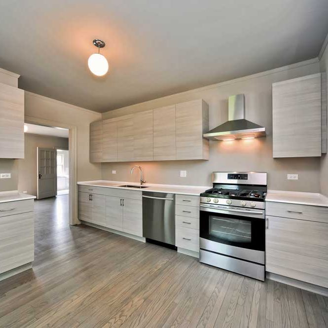 Westover Townhomes beautiful kitchen outfitted with custom cabinetry, quartz countertops, and sleek Samsung stainless steel appliances