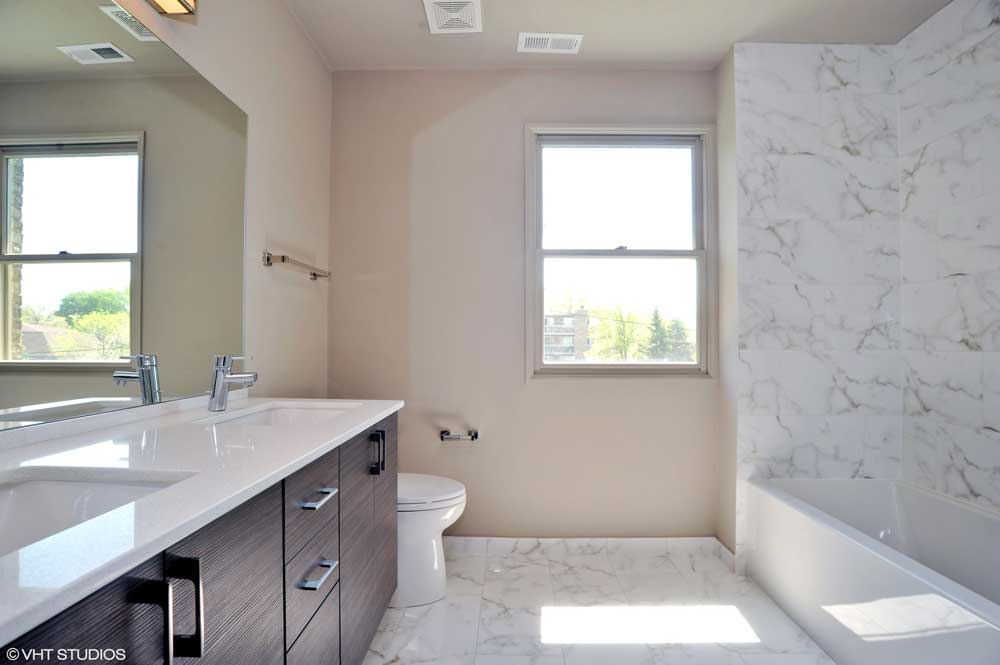 Westover Townhomes bathroom with designer tile, high-end Grohe plumbing fixtures and TOTO toilets
